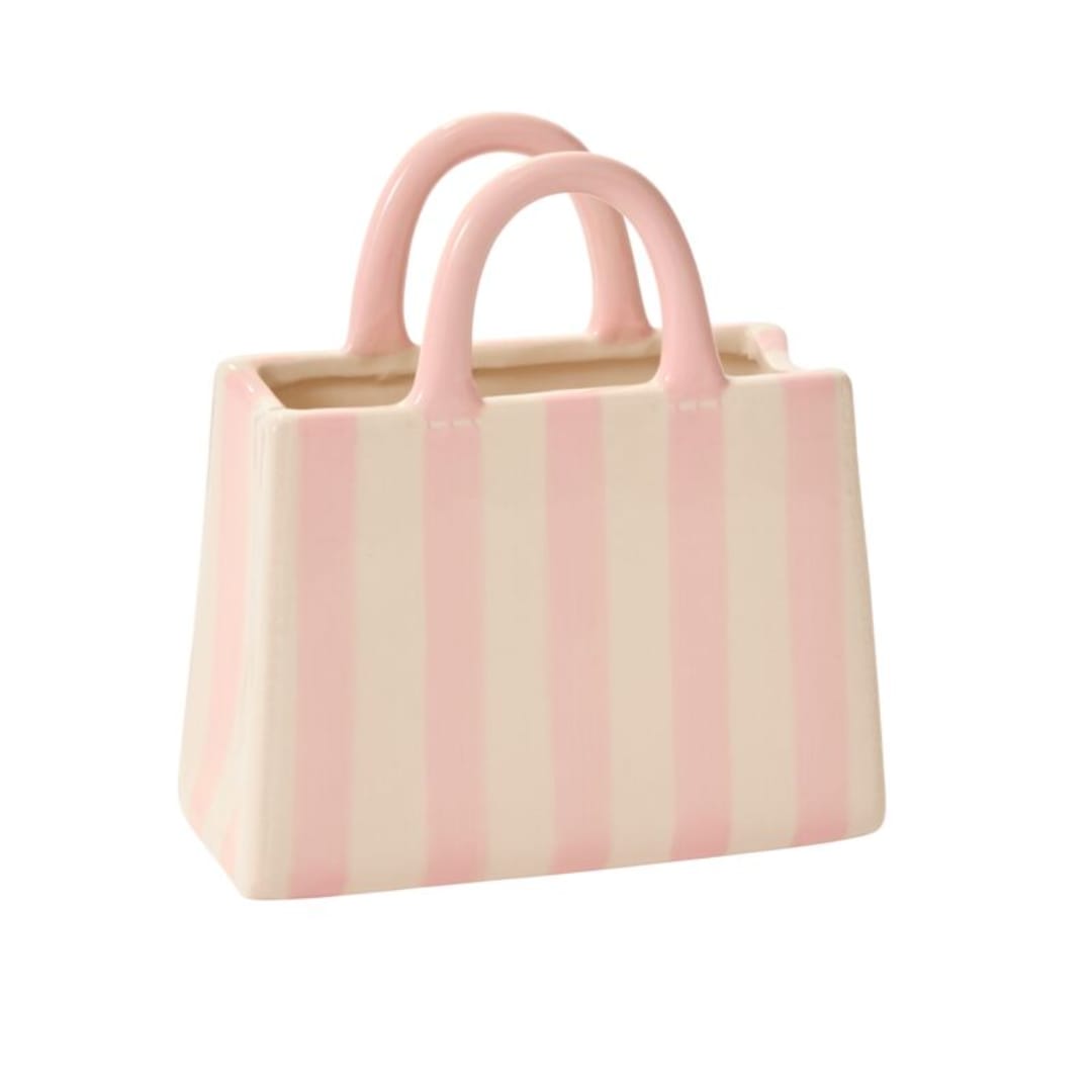 Ashley's Handbag Vase - 7.75"x 3.5"x 8.5" You haven't seen a vessel quite like the Miranda Handbag Vase, perfect for a Mother's Day or birthday gift paired with lush, overflowing florals. This ceramic tote bag features white &amp; pink vertical stripes, a glossy finish, &amp; upright handles. The size, shape, &amp; flat sturdy base allow for easy floral transport &amp; delivery &amp; the Miranda is versatile for repurposing as a fun display in the home. STANDARD: INCLUDES VASE ONLY  DELUXE &amp; PREMIUM: includes florist choice flowers
