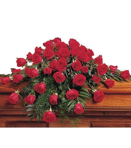 Casket Spray Faithfully Yours - Casket Spray Includes Red Roses And Greenery On A Saddle.