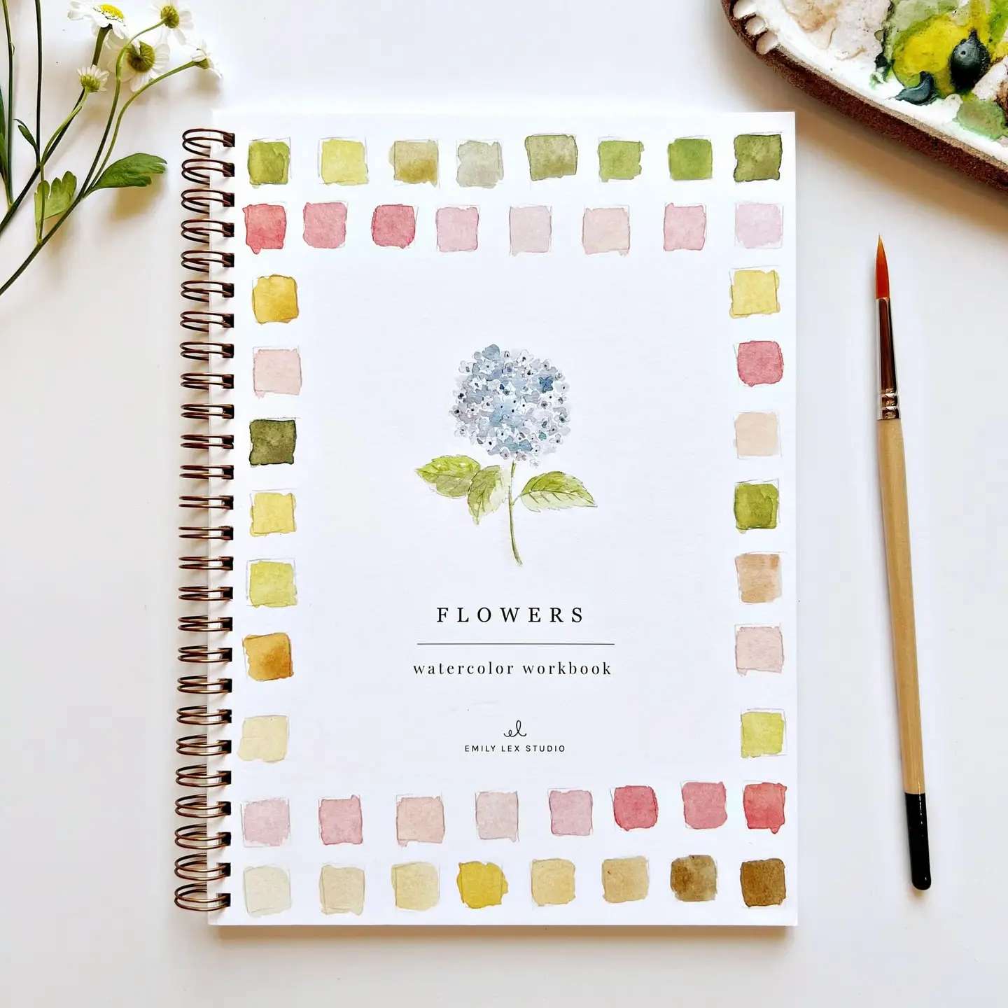 Watercolor flower workbook with a painted hydrangea on the cover