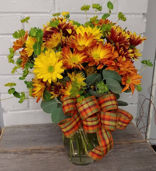 Fall Daisies - Fall daisies mixed in a clear vase with fall fillers.  