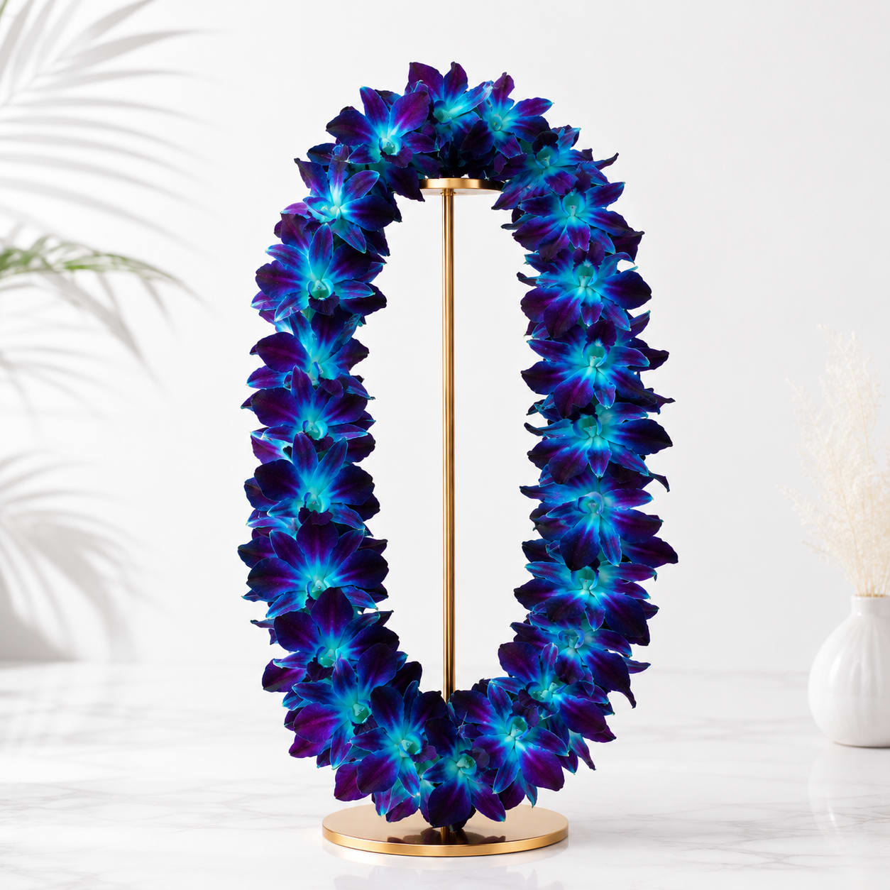 Blue Dendrobium Orchid Lei - Celebrate life’s most memorable milestones with this stunning Blue Dendrobium Orchid Lei. Featuring vibrant blue orchids arranged in a lush tropical design, this handcrafted lei symbolizes achievement, honor, and new beginnings. Perfect for graduations, ceremonies, birthdays, and special celebrations, it creates a striking and unforgettable presentation.