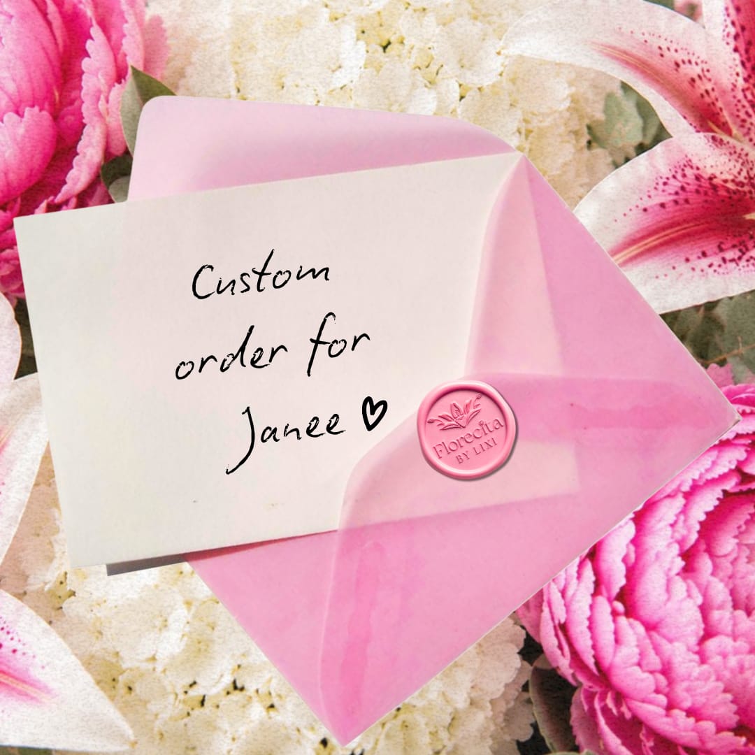 Pink envelope with a custom order note on a floral background