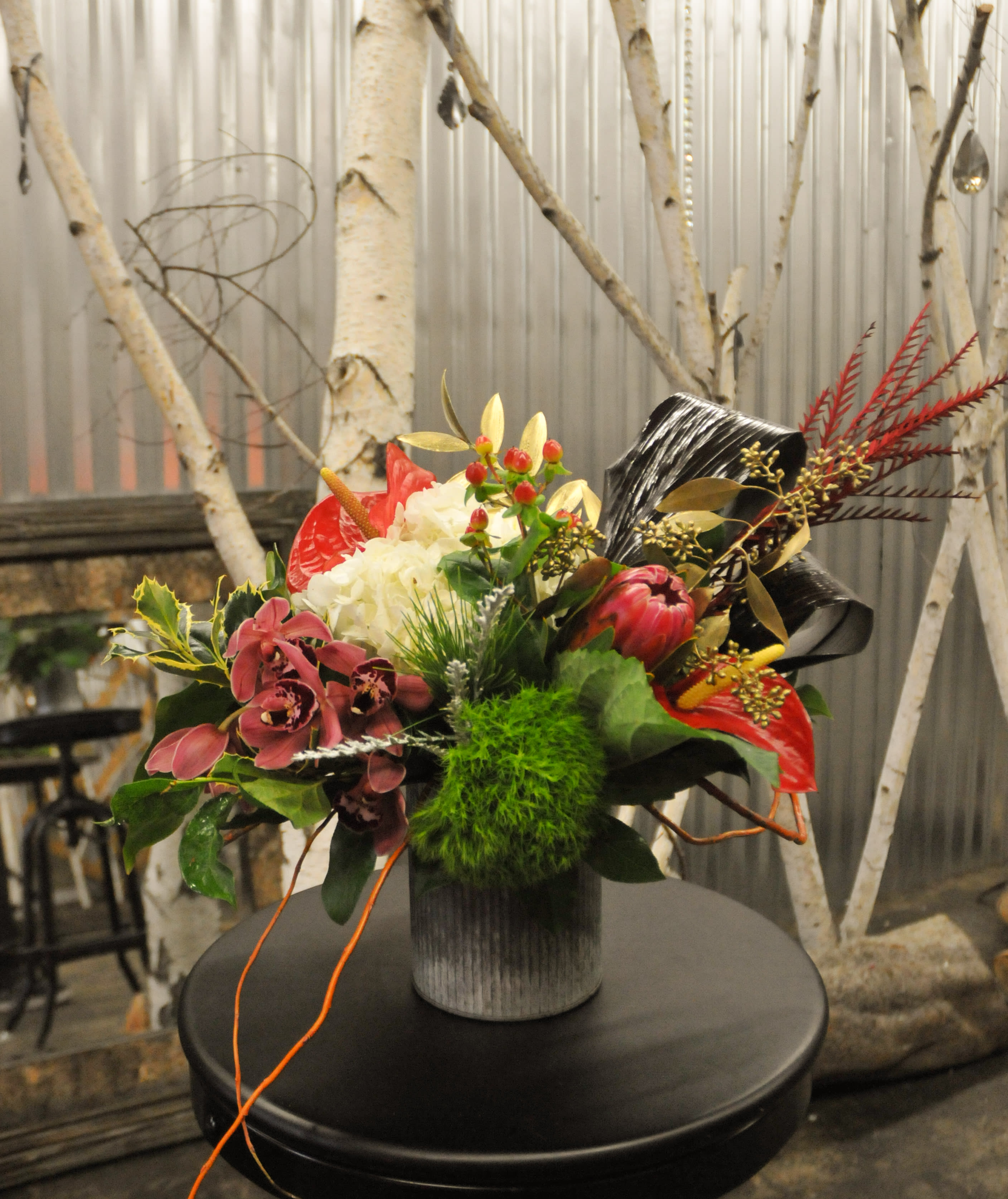 Tropical Aussie Christmas - Beautiful mix of tropicals, hydrangea, orchids, and Christmas greens. Bring some color to this White Holiday Season!