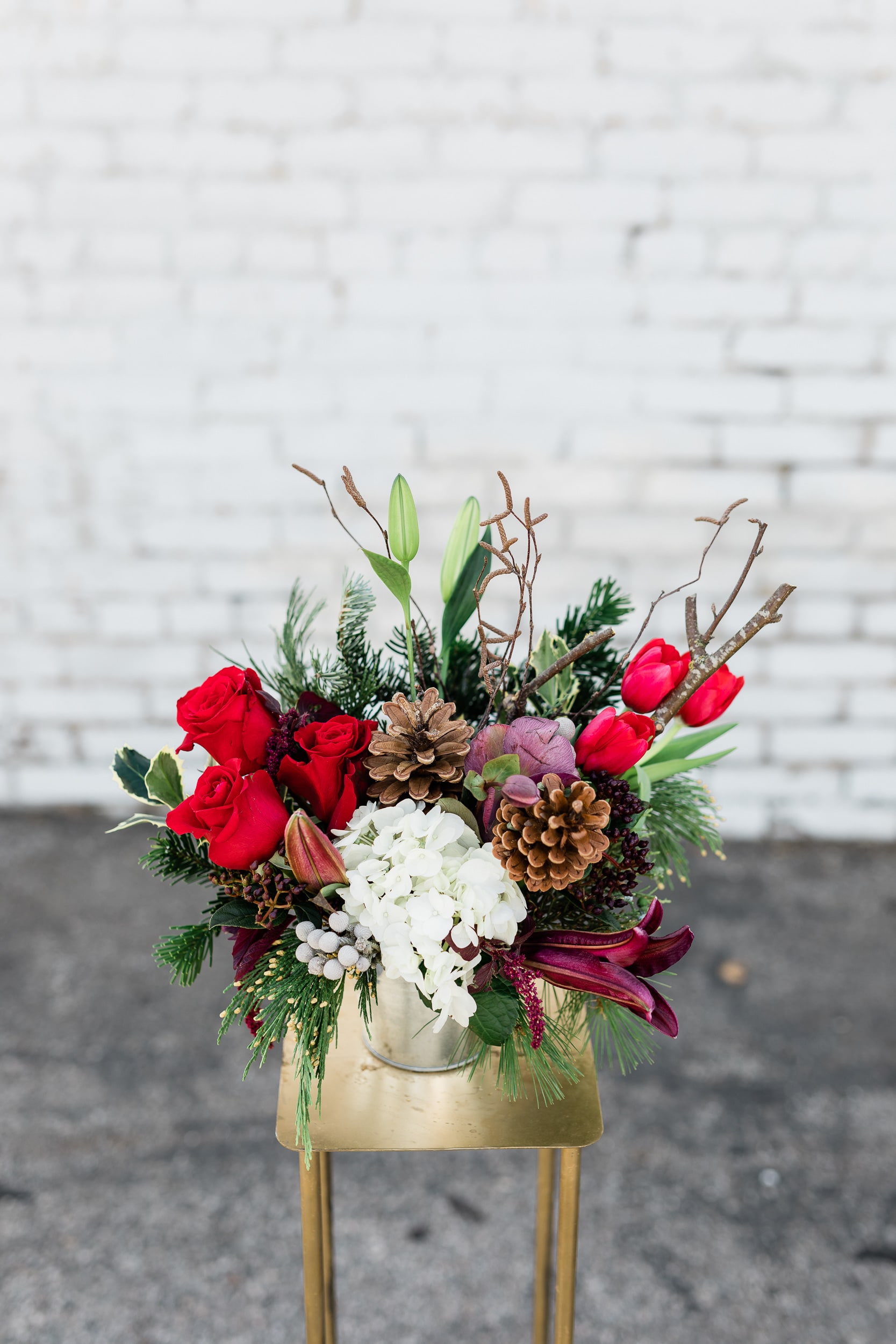 Julia's Heart - Stunning mix of holiday blooms and greens.   pictured [DELUXE]
