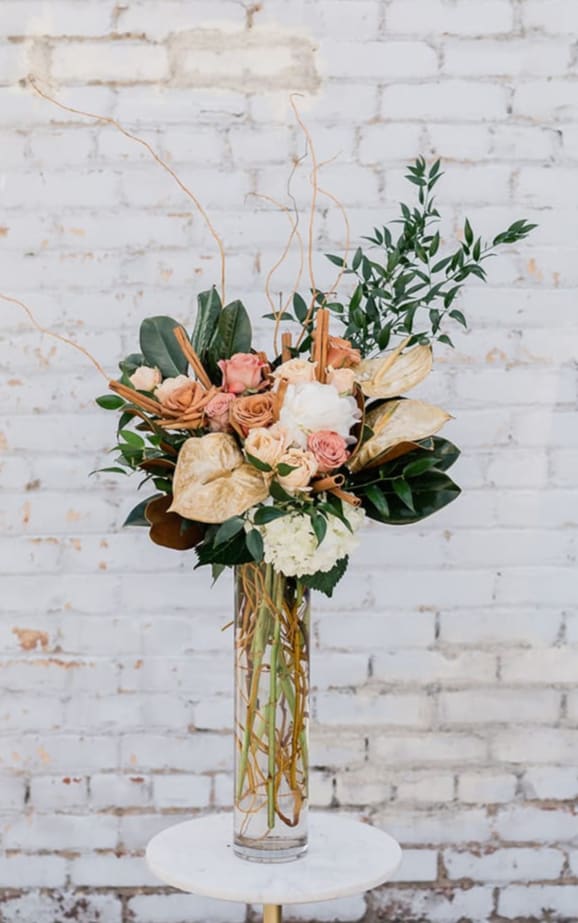 Making Spirits Bright - Cozy on up and Drink in the Holiday Spirit with our new Winter Collection! Designed to capture the essence of the holidays and bring joy to all. You will surely be Making Spirits Bright with the gift of this arrangement. Arranged with a stunning mix of neutral premium blooms and textures, accompanied by winter greens all eloquently designed in one of our hand-picked vases.  Pictured is [DELUXE]  *Some items in this arrangement must be special ordered, please allow 1-2 weeks notice to allow time for arrival of special items, otherwise, substitutions will occur.*