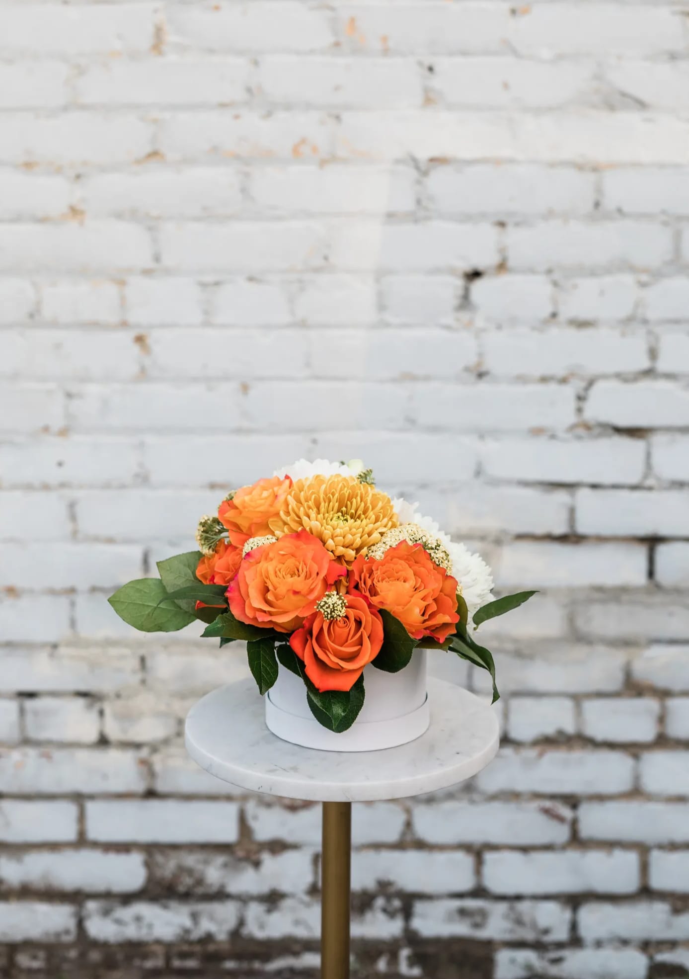 Luminous Horizon - Celebrate the clear skies and summer vibes with our new Summer Collection! Inspired by the natural masterpiece of the sky, the Luminous Horizon comes arranged with a beautiful mix of illuminating golden color, orange, and white premium blooms and textures, all eloquently designed in one of our hand-picked designer hat boxes.  Pictured [STANDARD]  *Some items in this arrangement must be special ordered, please allow 1-2 weeks notice to allow time for arrival of special items, otherwise, substitutions will occur.*