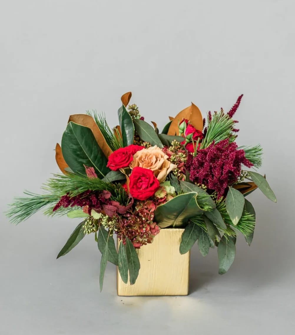Candlelight Glow - Get in the Holly Jolly Spirit with our dreamy Holiday Collection! Inspired by the warmth and memories of holidays past, Candlelight Glow comes arranged with jewel toned premium blooms and textures, accented with holiday greens, all elegantly arranged in one of our hand-picked designer vases.  Pictured [DELUXE]  *Some items in this arrangement must be special ordered, please allow 1-2 weeks notice to allow time for arrival of special items, otherwise, substitutions will occur.*