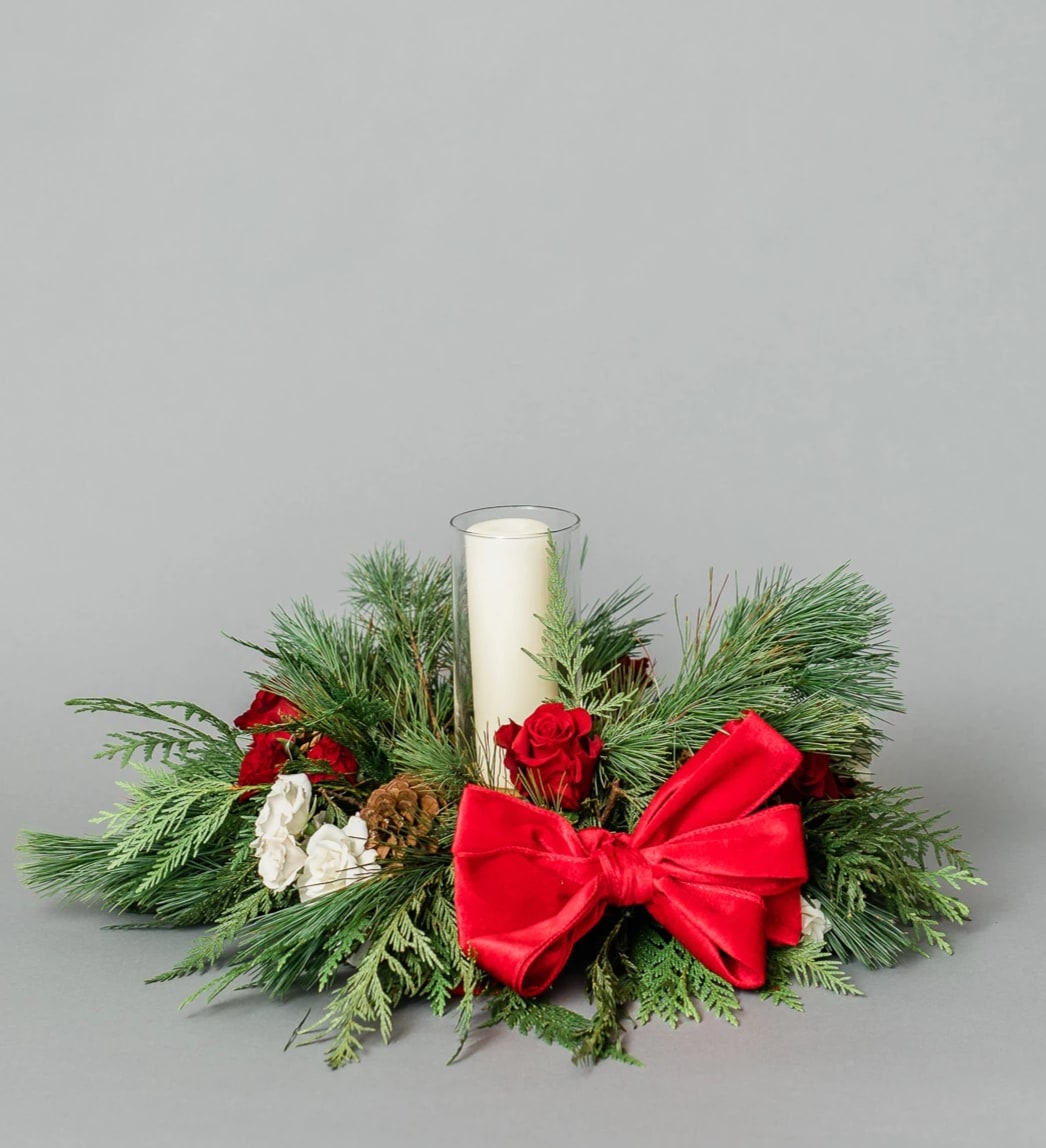 Stocking Aspiration Centerpiece - Get in the Holly Jolly Spirit with our dreamy Holiday Collection! Inspired by the warmth and memories of holidays past, Stocking Aspiration Centerpiece comes arranged with white and red premium blooms and textures, accented with holiday greens, all elegantly arranged low and round on a clear acrylic tray with a spot in the middle for a candle or decorative figure to be placed.  Pictured [STANDARD]  Candle NOT included  *Some items in this arrangement must be special ordered, please allow 1-2 weeks notice to allow time for arrival of special items, otherwise, substitutions will occur.*