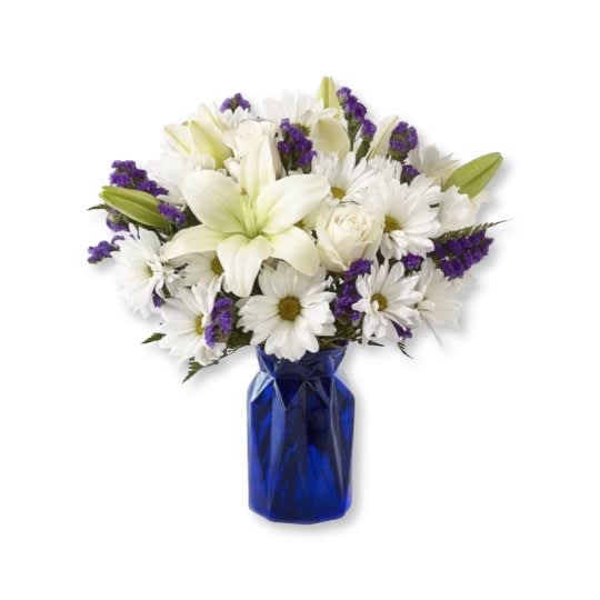 White lilies, daisies, and roses in a blue vase