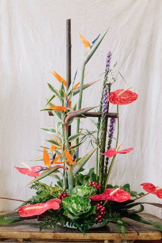 Tall tropical arrangement with bird of paradise and red anthuriums