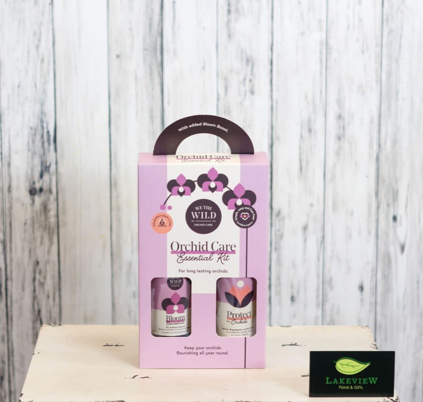 Pink orchid care kit box with two bottles in a windowed package