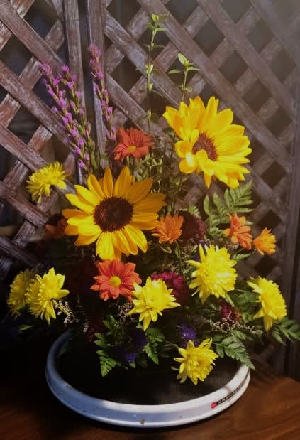 Sunny Sunflowers - A bouquet of smiles in both the late summer and autumn.  Accompanied by yellow cushion mums, daisies and purple liatris, this sunflower arrangement is sure to please.  