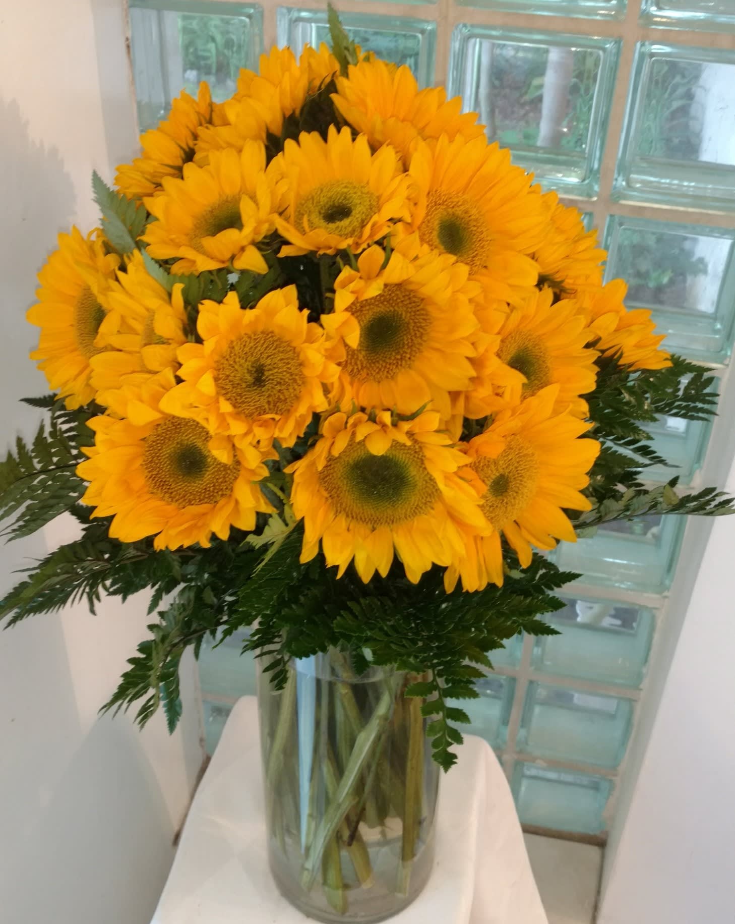 25 Sunny Sunflowers. - We've filled a vase full of sunflowers (well, at least 25) to give you the sunniest of all floral arrangements. IMPORTANT: Your gift will use either the "Teddy Bear" sunflowers with the light brown center or the "Van Gogh" sunflowers with a dark brown center, whichever is the freshest and most vibrant on the day of delivery. 