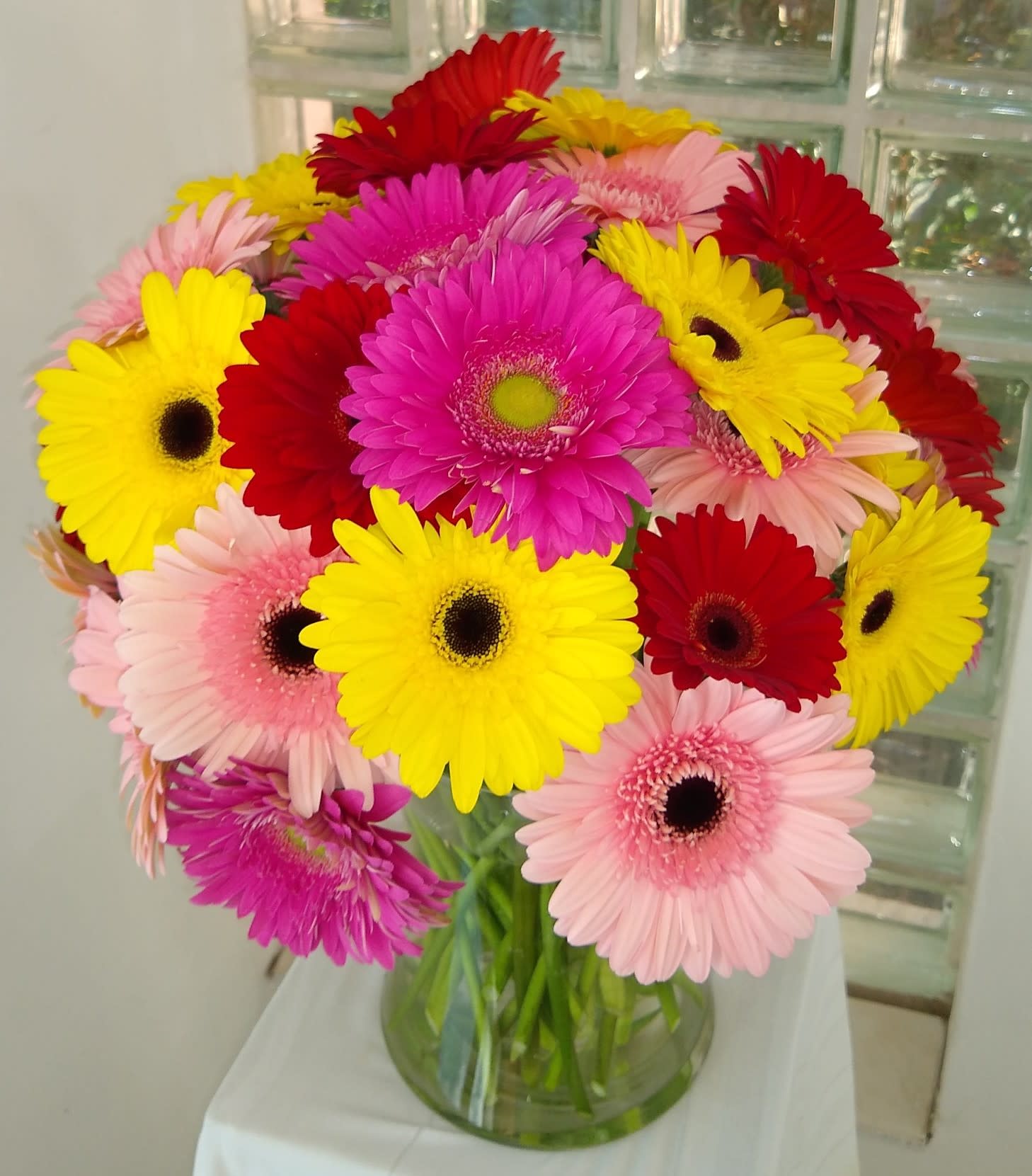 Super Sparkling Gerbera - One of the happiest flowers we know are the gerbera.  They come in many different colors.  Designed by Mother Nature to cheer anyone up!