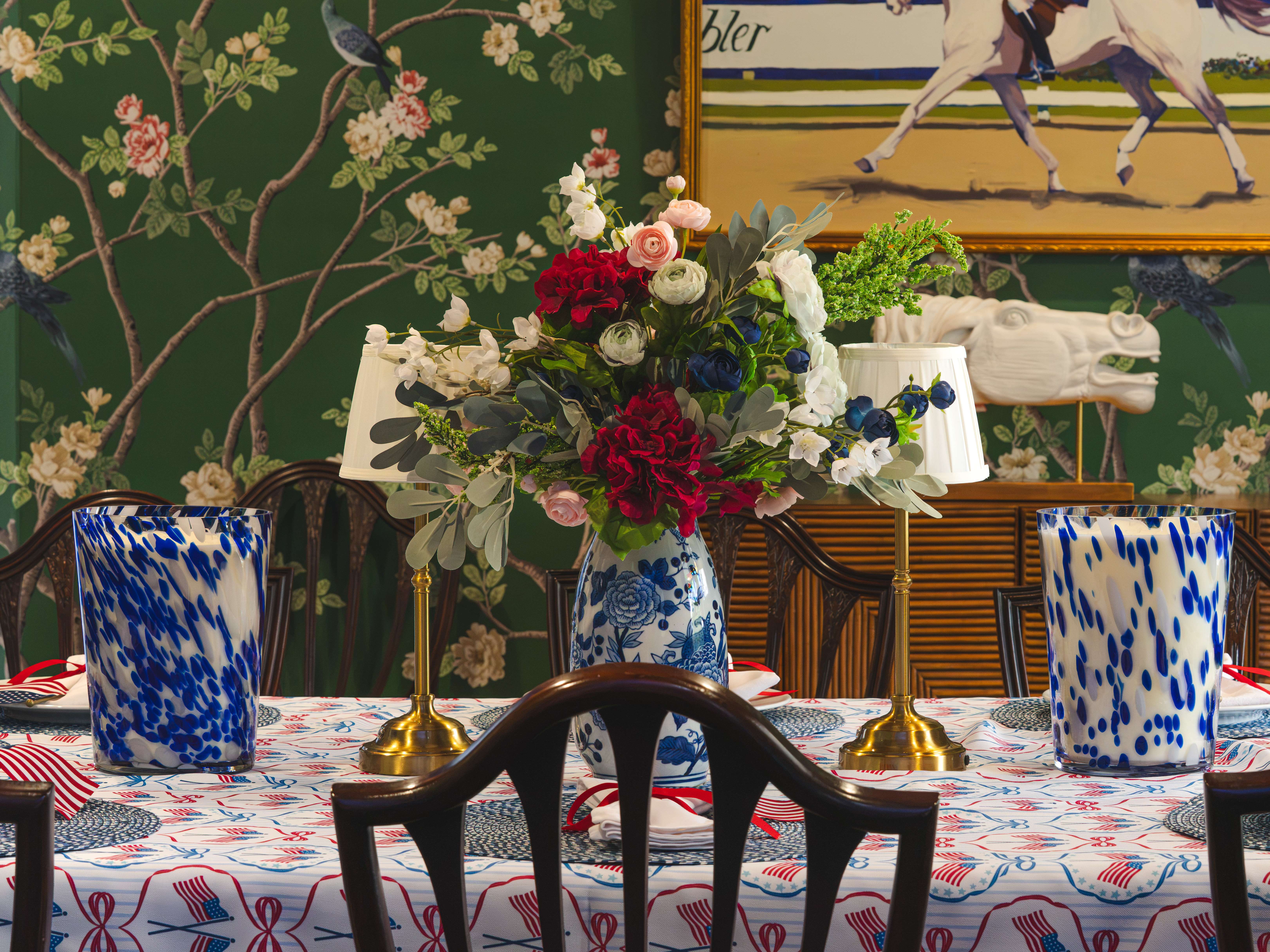 Floral centerpiece in a blue-and-white vase on a decorated table