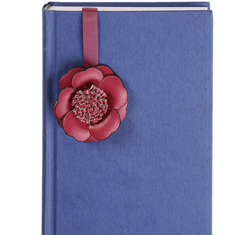 Blue book with a red flower bookmark ribbon