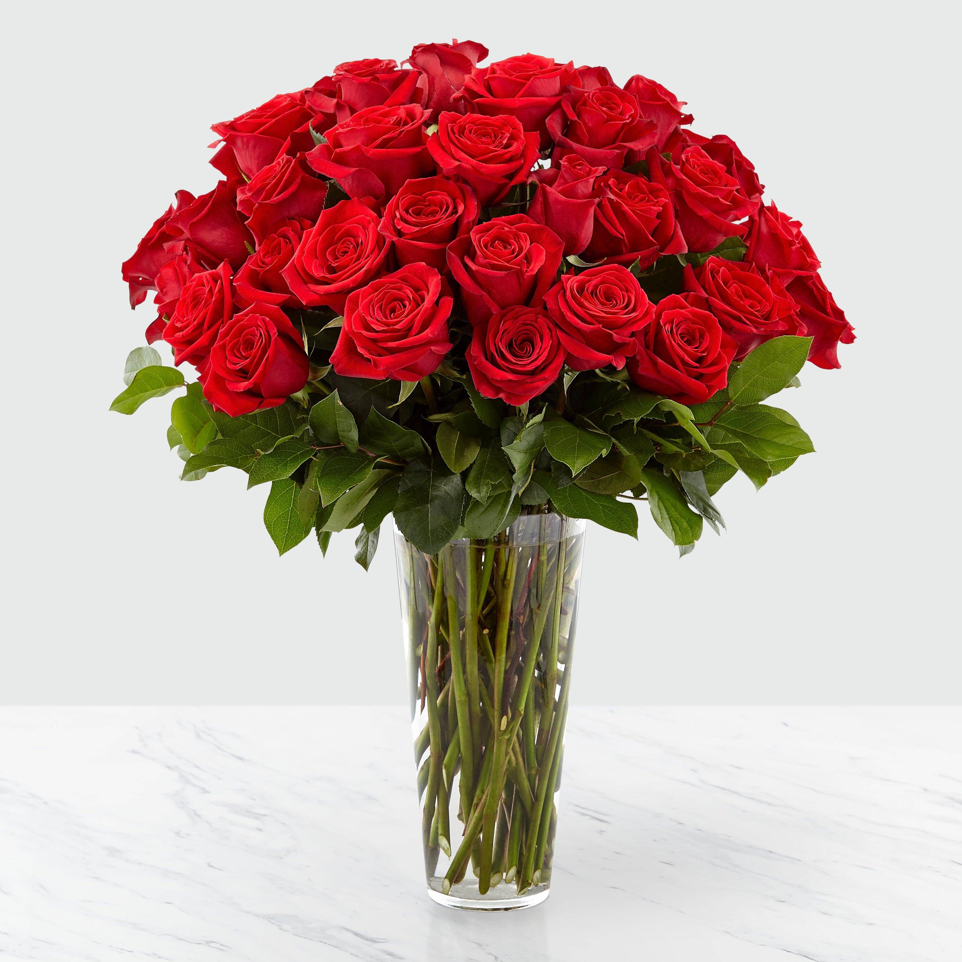 Bouquet of red roses in a clear glass vase
