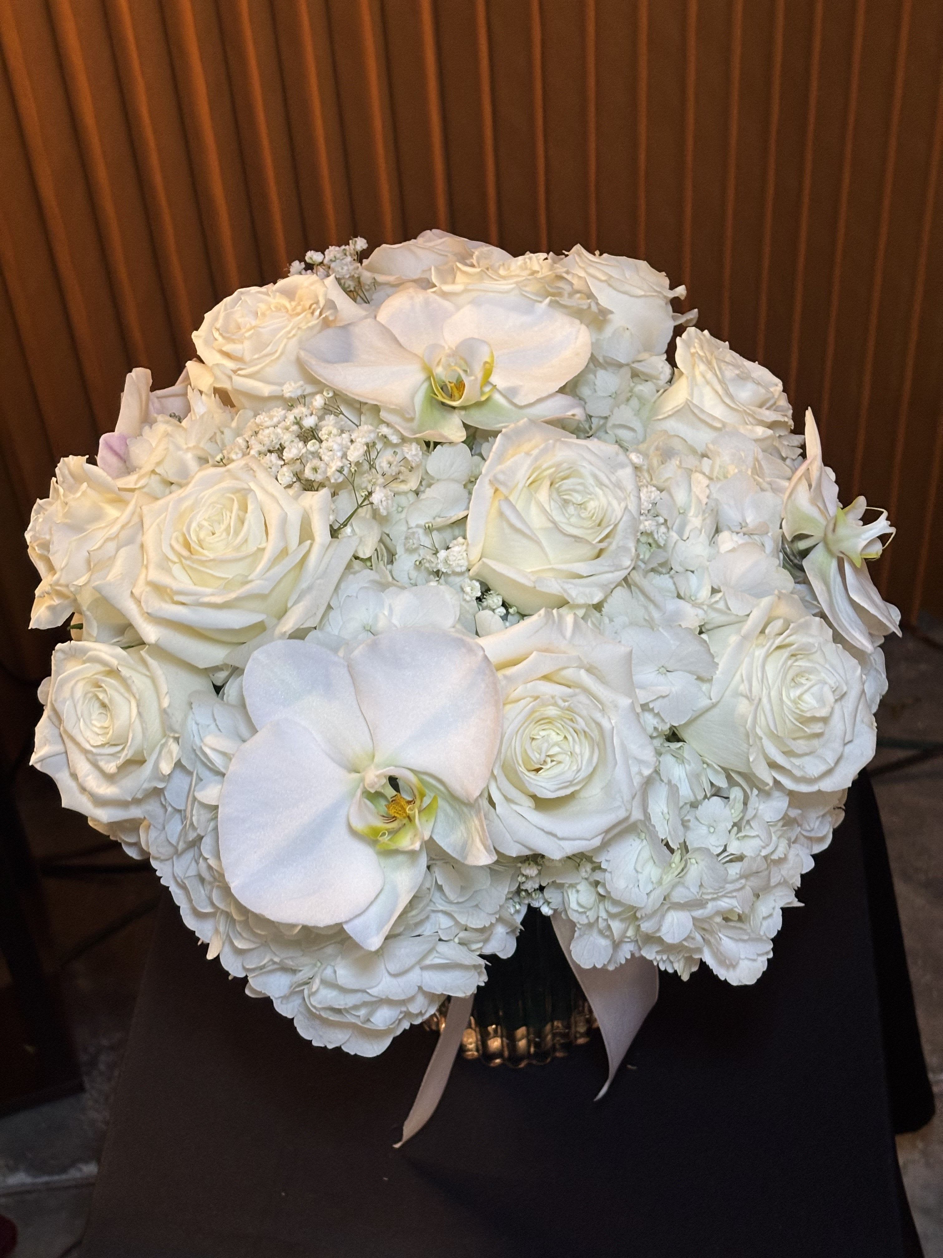 White rose and orchid bouquet with hydrangeas