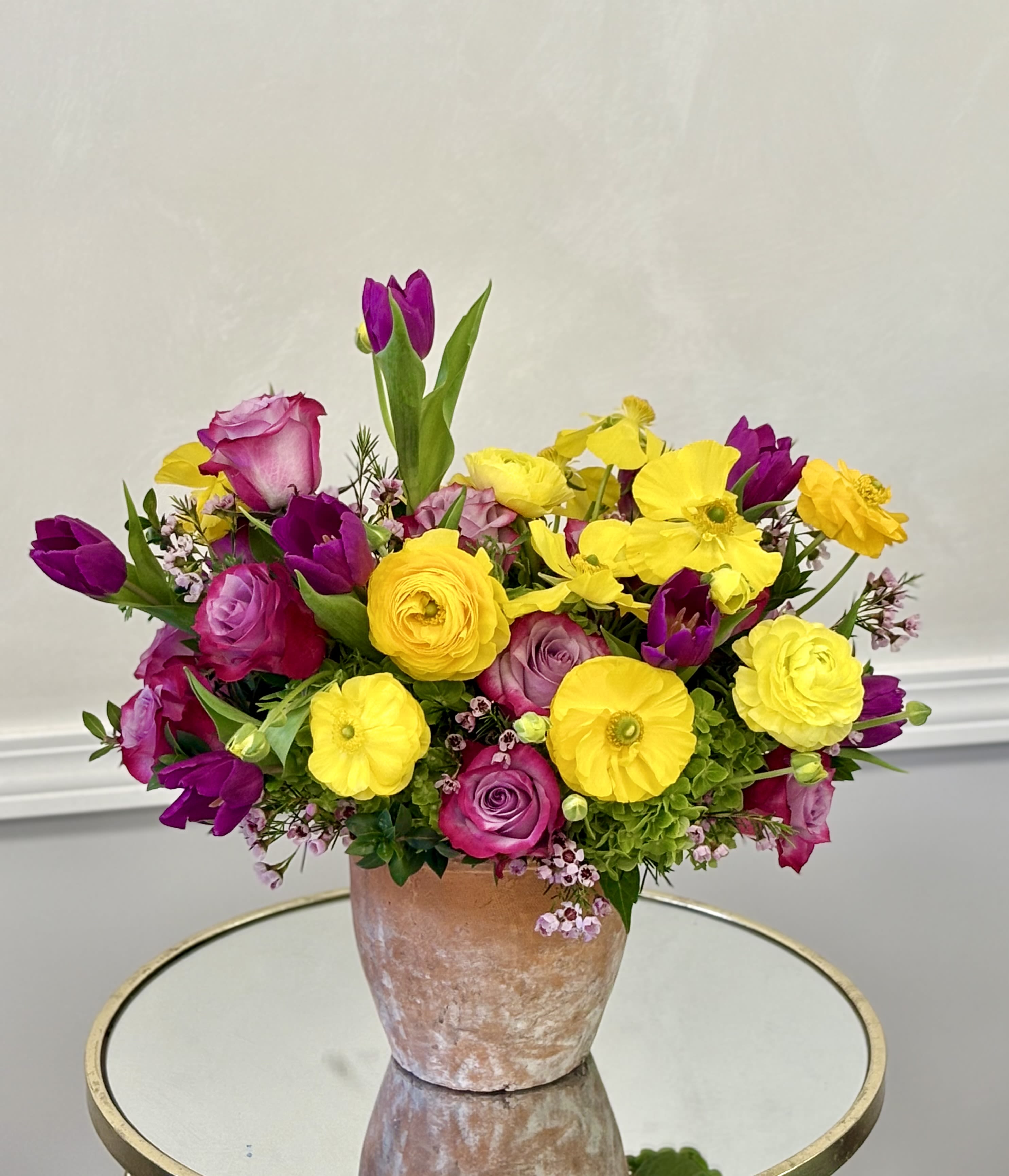 Spring Melody By VLM Flowers - A playful mix of bold yellows and vivid pinks creates a harmonious, garden-inspired composition. Soft textures and lively colors dance together, making this arrangement feel like a celebration of spring in full swing.