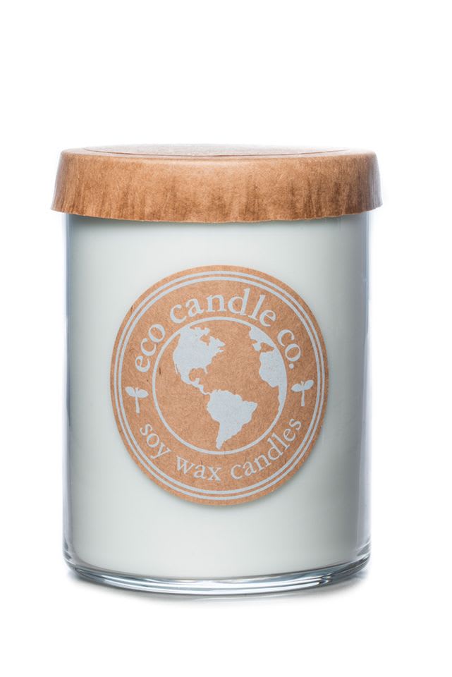 Soy wax candle in a glass jar with a wooden lid