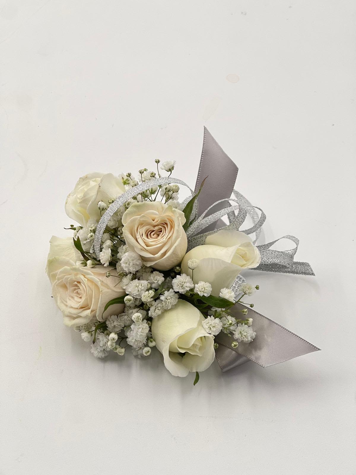 Small bouquet of cream roses and white filler flowers with silver ribbon