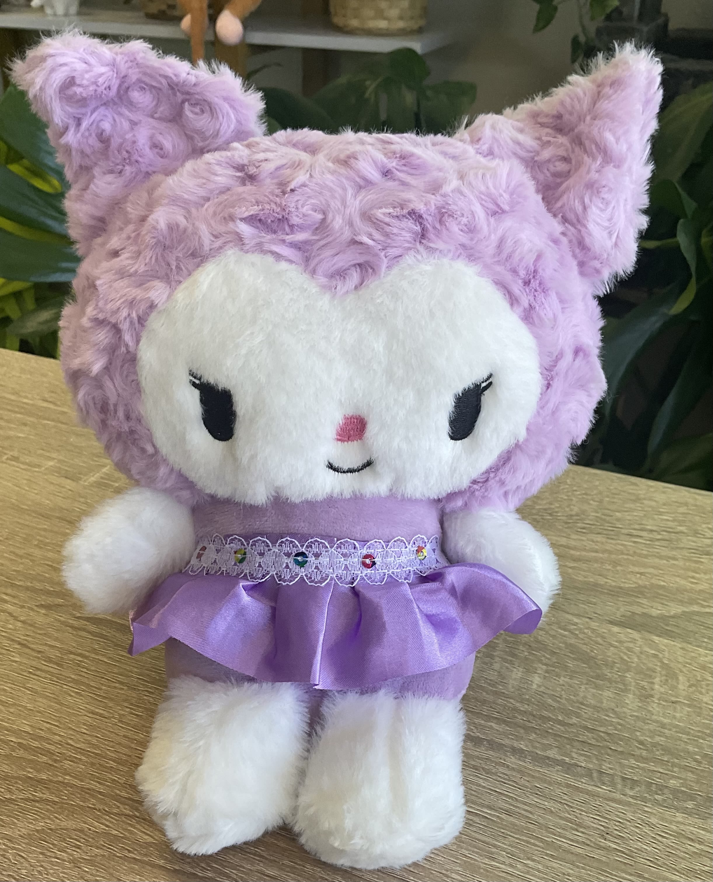 Lavender plush cat toy in a purple dress