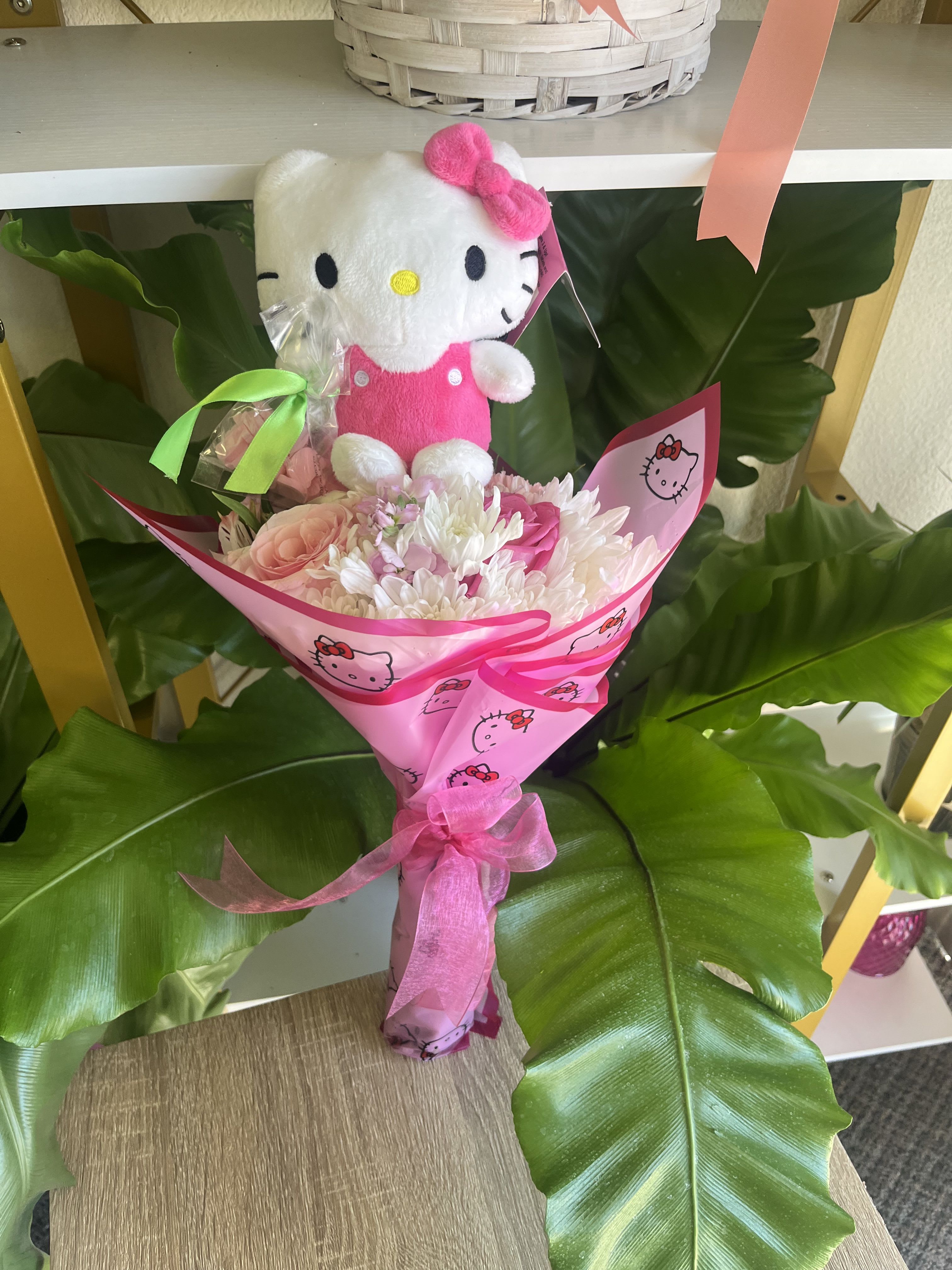 Pink bouquet with a Hello Kitty plush and ribbon wrap