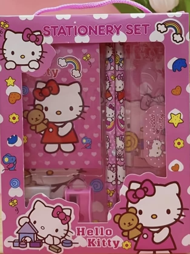 Pink Hello Kitty stationery set in a gift box with notebook and pens.