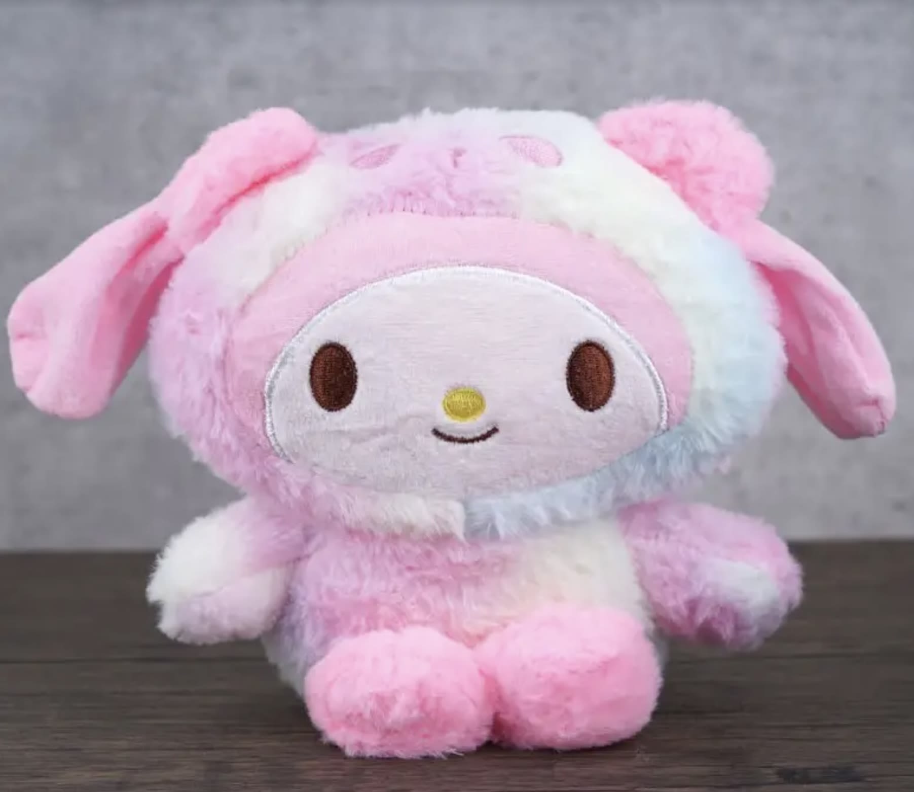 Pink and white plush bunny character toy with floppy ears
