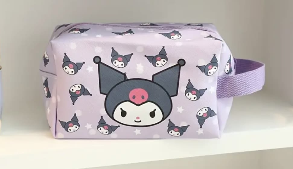 Lavender zip pouch with a cartoon character print and side strap