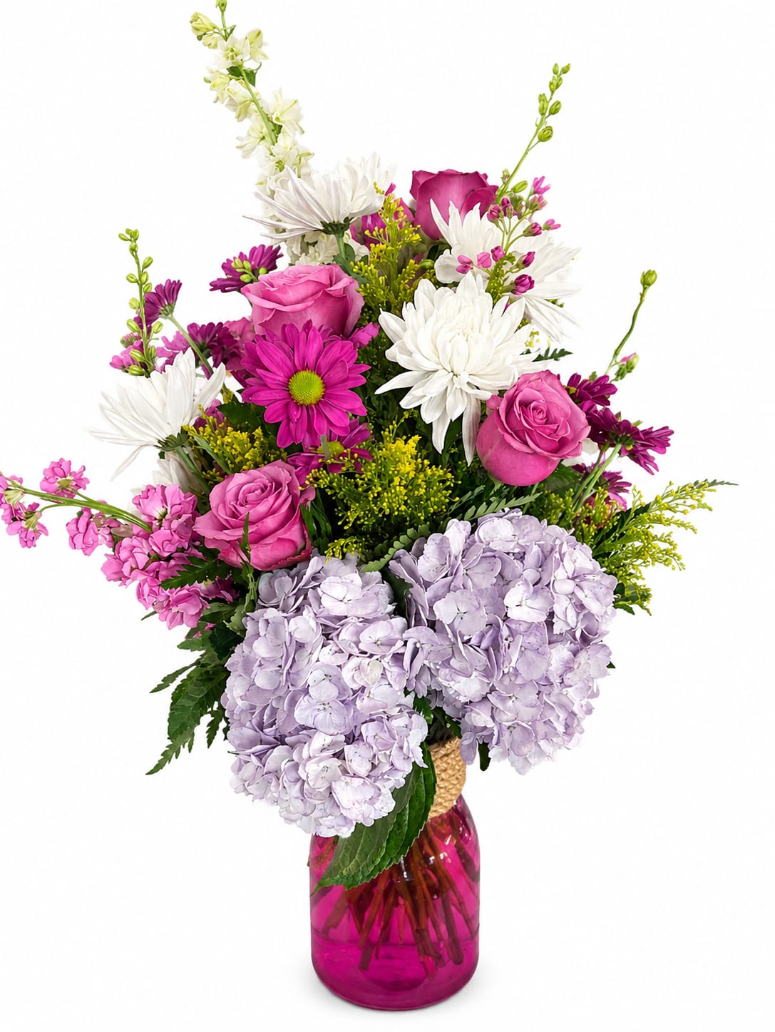 Pink and white mixed bouquet in a magenta glass vase