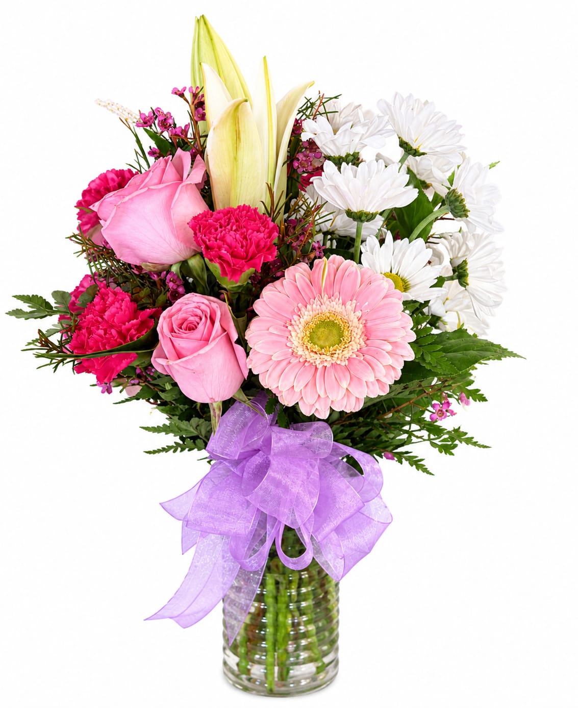 Pink and white mixed bouquet in a glass vase with a purple ribbon