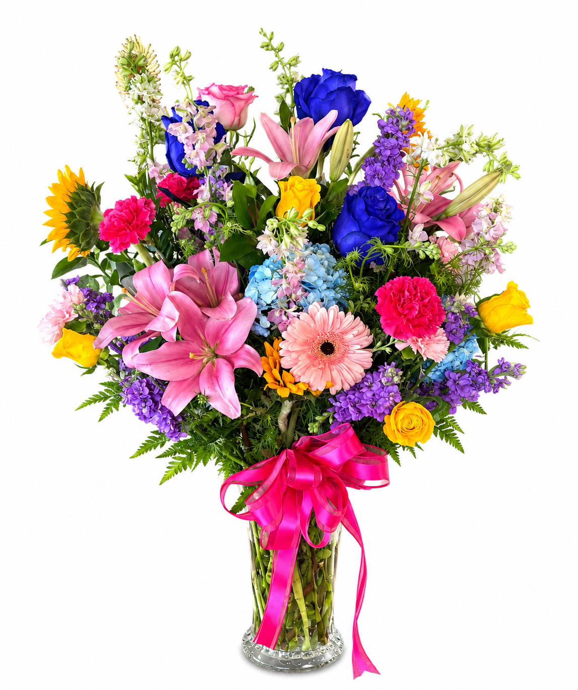 Colorful mixed bouquet in a clear glass vase with a pink ribbon