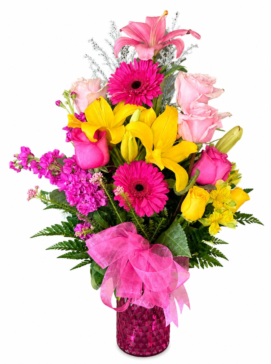 Bright mixed bouquet in a pink vase with a large ribbon