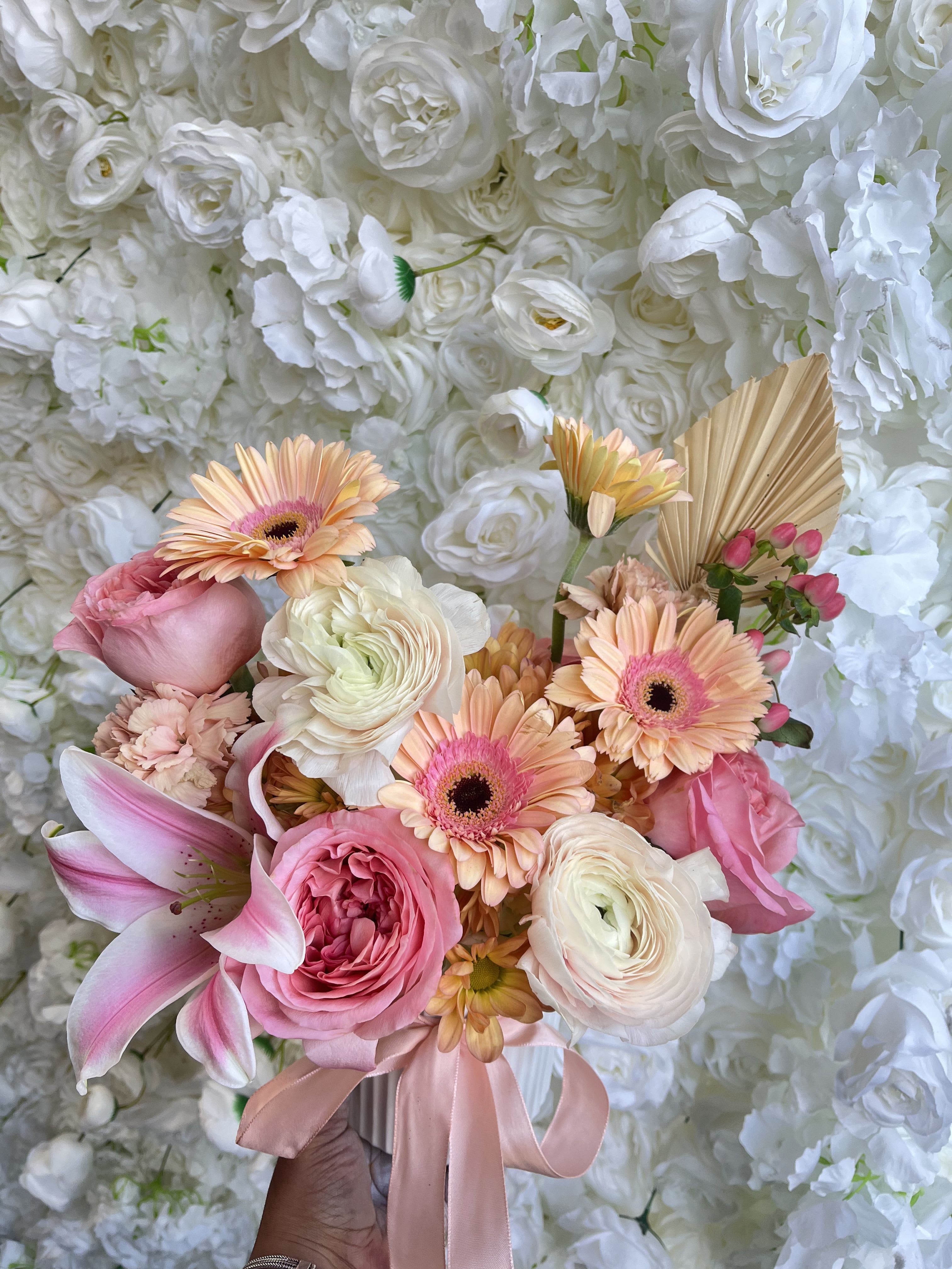 Pink and peach bouquet with lilies, roses, and gerbera daisies