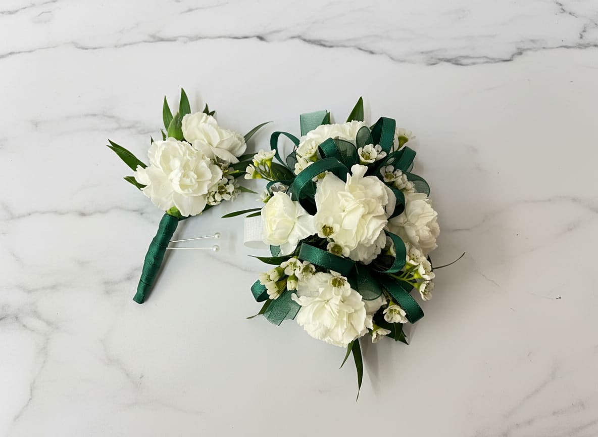 Carnation Corsage &amp; Boutonnière  - Carnation boutonniere and corsage set accented with wax flower and greenery. The corsage comes on an adjustable Velcro wristlet, and the boutonniere is attached with a magnet for easy wear. Ribbon color is customizable, please add your choice in the special instructions.