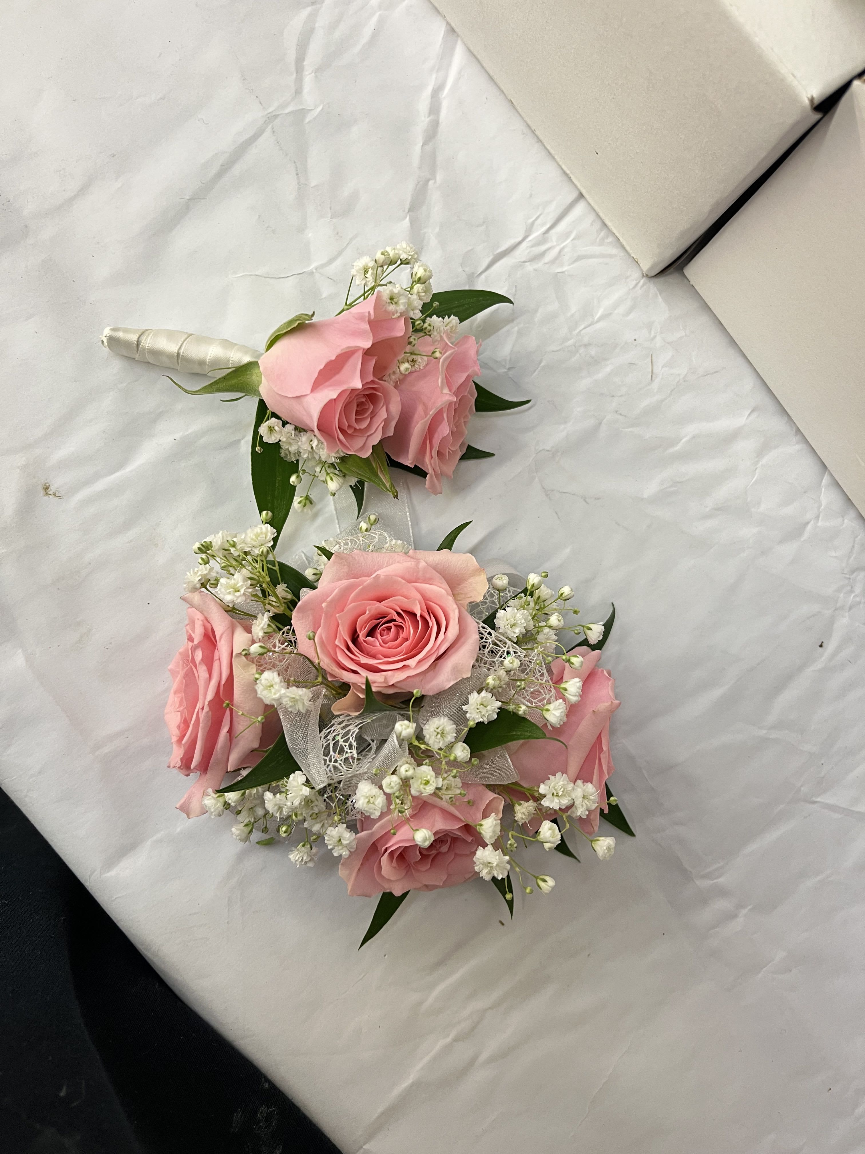 Pink Rose Corsage &amp; Boutonnière  - Pink rose corsage and boutonniere set for a soft, romantic look. The corsage comes on an adjustable Velcro wristlet, and the boutonniere is attaches with a magnet for easy wear. Ribbon color is customizable, please add your choice in the special instructions. Baby’s breath can be added upon request, just include it in your notes.