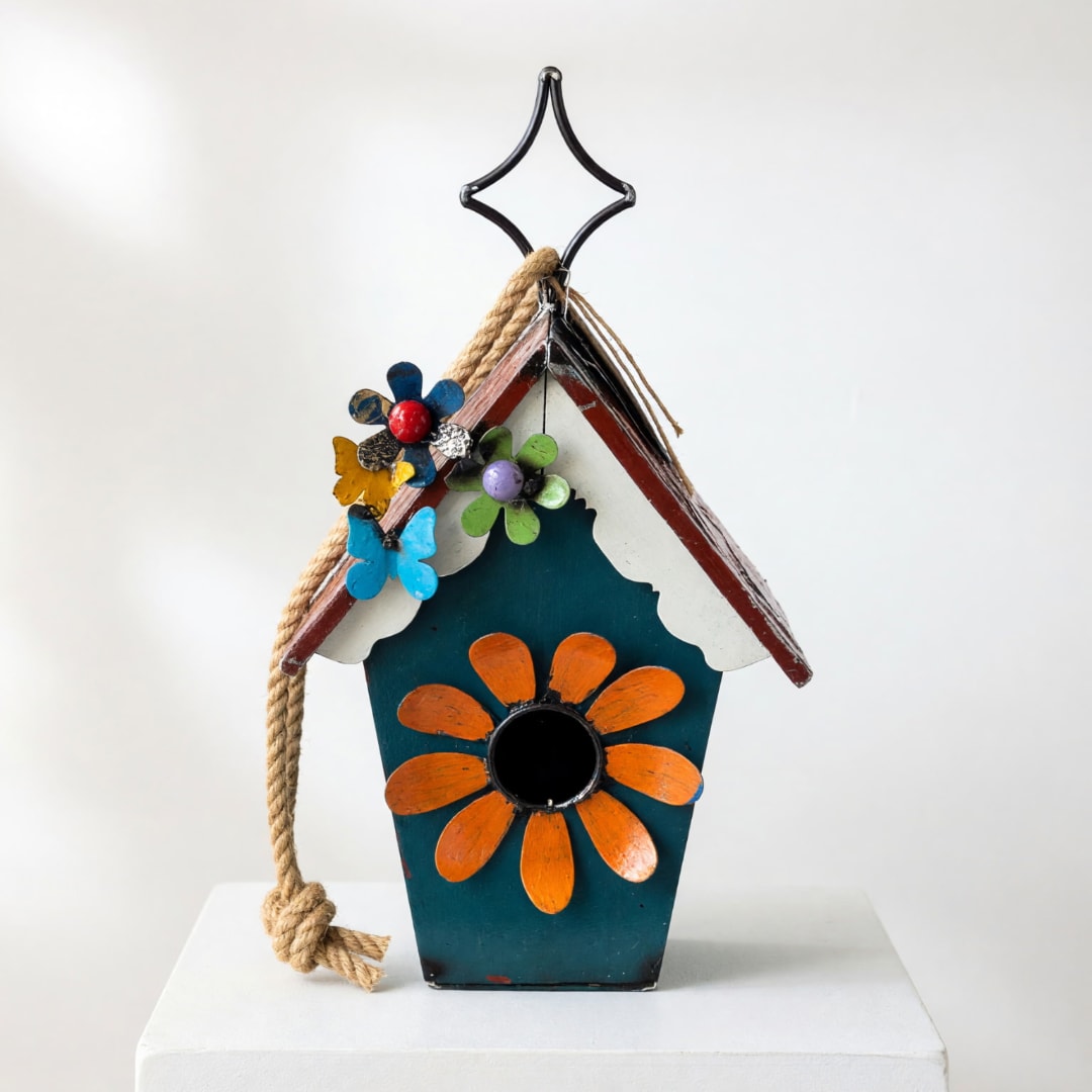Decorative birdhouse with painted flowers and a rope hanger