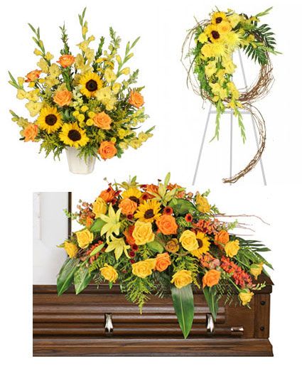 Golden Reflections Sympathy Collection - Honor the memory of your loved one with our Golden Reflections Sympathy Collection. Full of beautiful warm shades and tones and a lovely selection of sunflowers, roses, snapdragons, and more, this collection is a tasteful choice for any service.  Includes: Casket Spray:,  casket Saddle With, Branches And Vines, Foliage: Jade, Leather Leaf, Aspidistra Leaves, Hosta, Acuba, Yellow Lilies, Yellow Roses, Orange Roses, Peach Snapdragons (Talisman), Rust Button Poms, Yellow Sunflowers , Standing Spray:,  , Large Grapevine Wreath, Foliage: Ivy, Lily Grass, Holly Fern, Sword Fern, Hosta, Variegated Pittosporum, Leather Leaf, Sprengeri, Yellow Gladiolus, Sunflowers, Yellow Roses, Yellow Spider Mums (Fuji), Yellow Cushion Poms, Solidago , Altar Arrangement: ,  j Mach Container, Foliage: Myrtle, Jade, Variegated Pittosporum, Sunflowers, Yellow Gladiolus, Yellow Snapdragons, Orange Roses, Yellow Button Poms, Solidago .