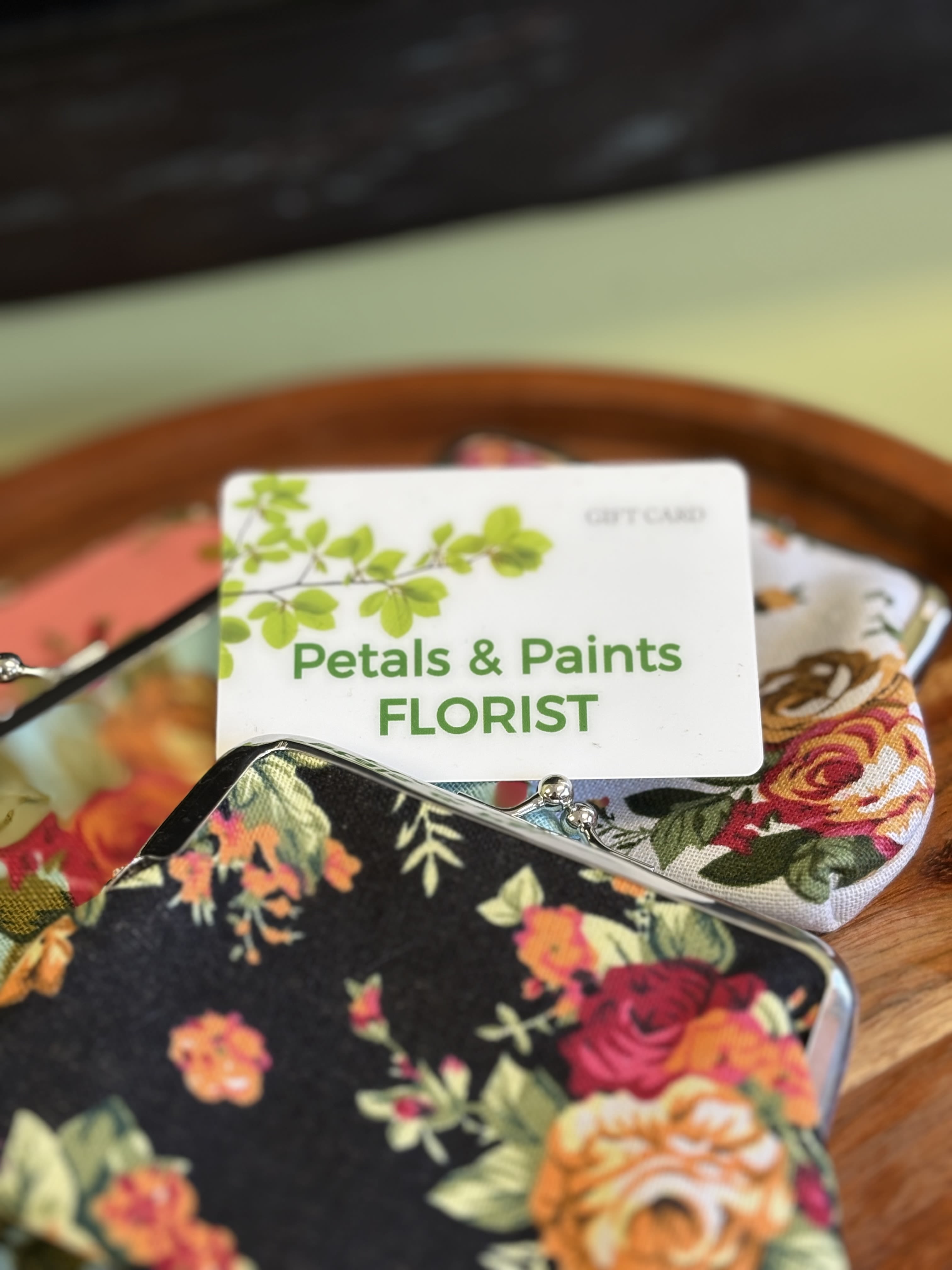Floral-patterned coin purses with a florist gift card