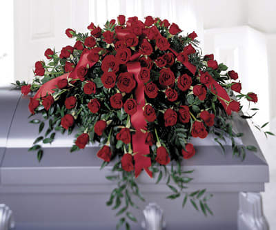 Dearly Departed Casket Spray - Dozens of red roses intertwined with greens in a traditional casket spray selection. (To be displayed on a casket).