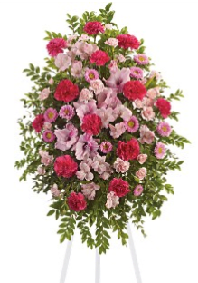 Pink Tribute Spray - With a bounty of lovely pink flowers and simple greens, this pretty spray lets you express your sympathy beautifully. Splendid pink, hot pink and light pink flowers such as alstroemeria, gladioli, carnations, asters and more create a display that is warm and loving. 