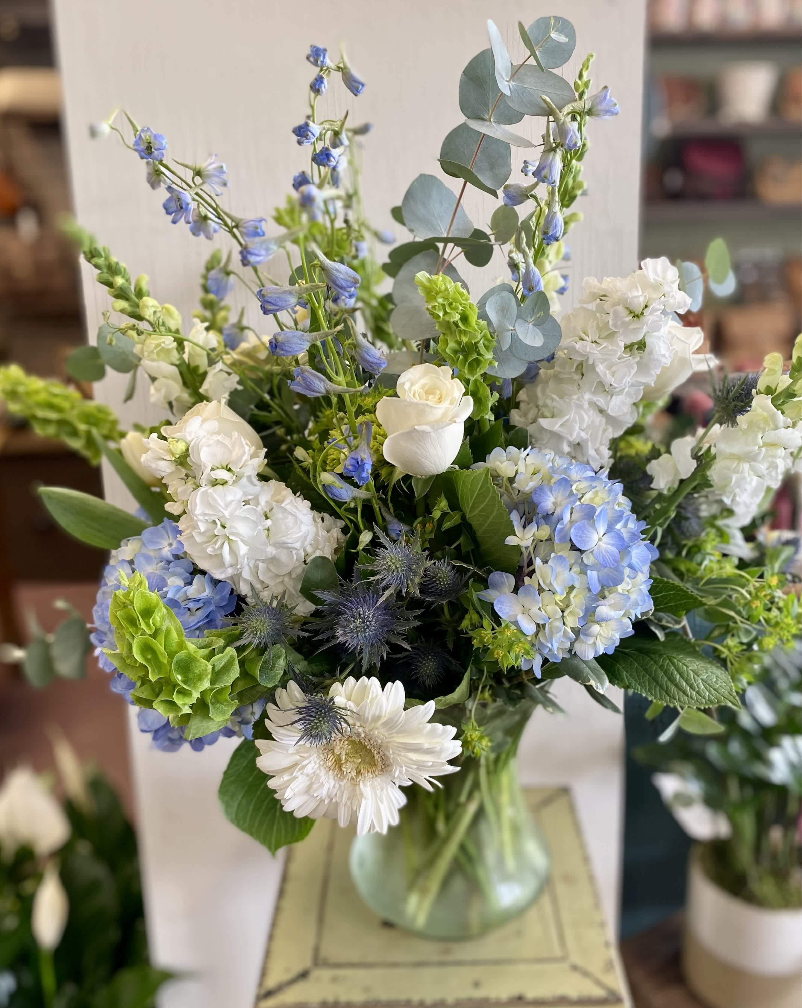 Blue and white mixed bouquet in a glass vase