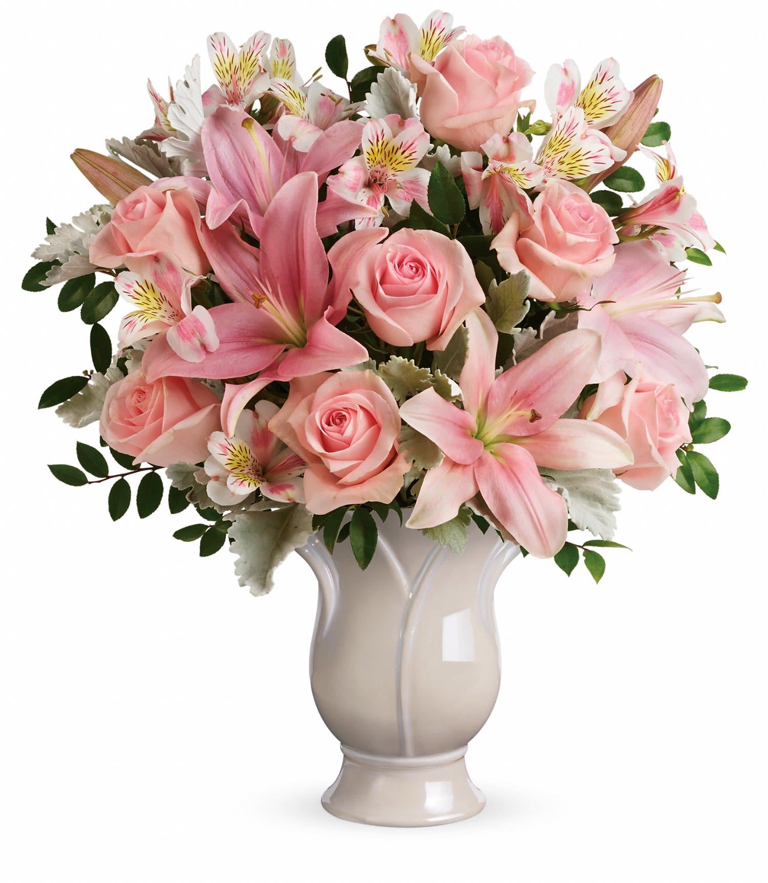 Pink roses and lilies arranged in a white vase