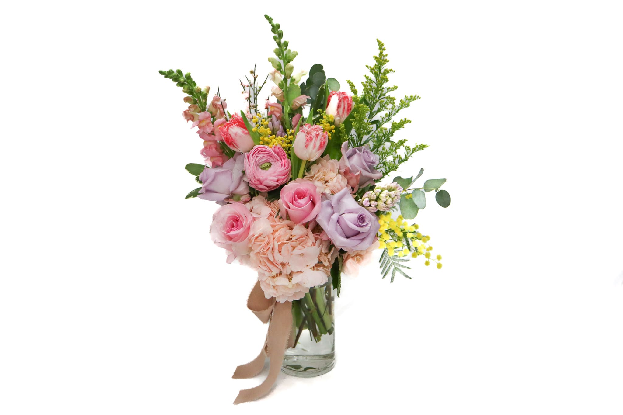 Pink and lavender bouquet in a clear glass vase