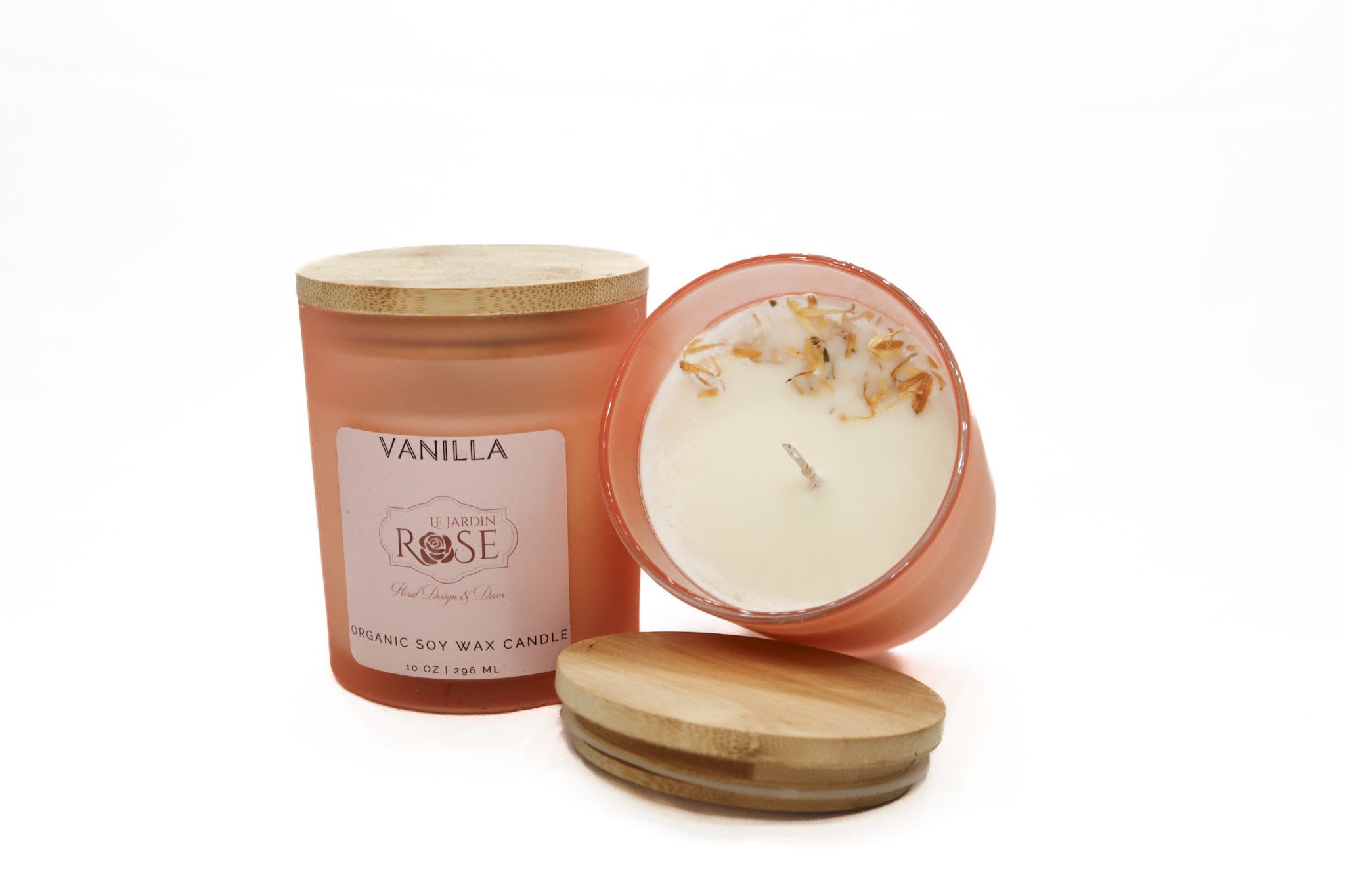 Two vanilla candles in frosted glass jars with bamboo lids