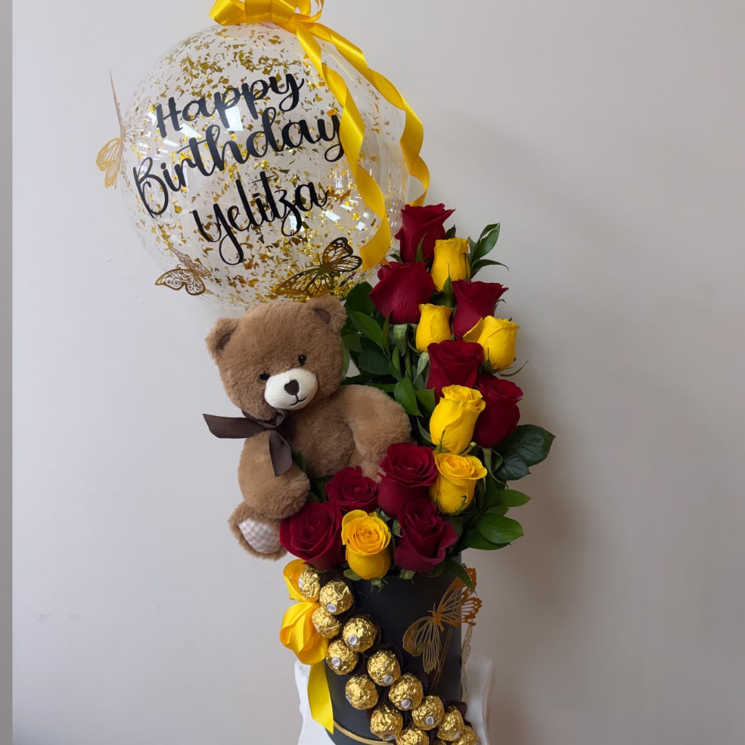 Rose arrangement with a teddy bear, birthday balloon, and chocolates