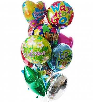 Cluster of colorful foil balloons with cheerful messages