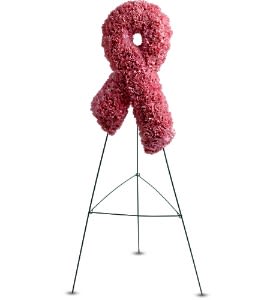 Tall pink floral awareness ribbon displayed on a metal easel stand