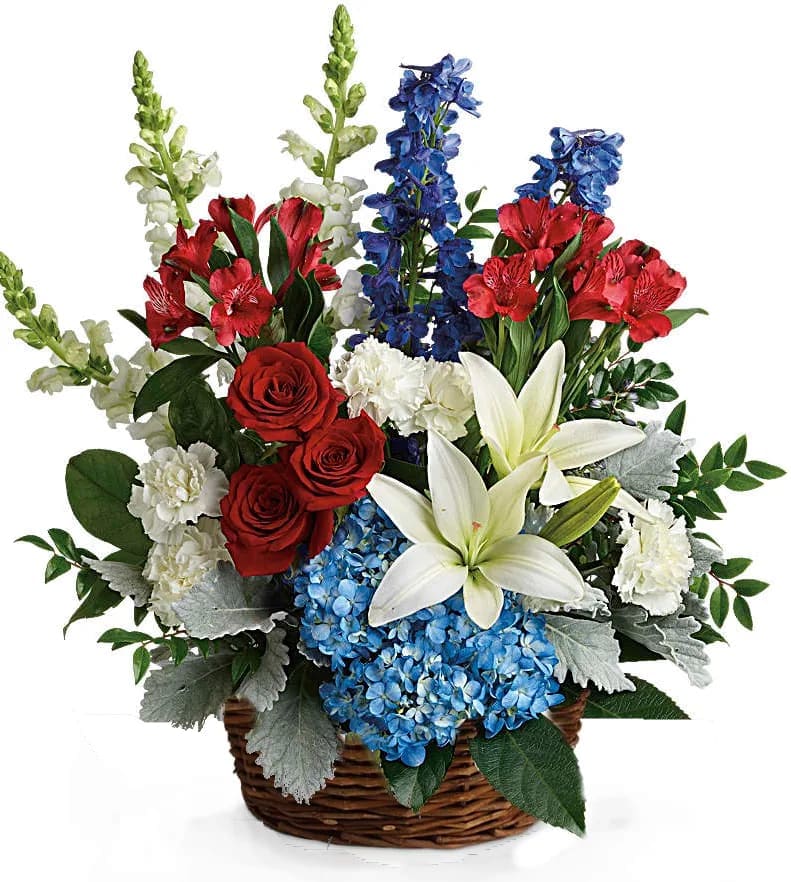 Red, white, and blue flower basket with roses, lilies, carnations, hydrangea, snapdragons, and delphinium